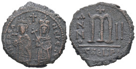 Phocas and Leontia, AD 602-610. AE, Follis. 9.57 g. 27.59 mm. Theoupolis (Antioch).
Obv: Phocas standing to left, crowned and holding globus cruciger ...