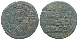 Theophilus, AD 829-842. AE, Follis. 8.60 g. 27.73 mm. Constantinople.
Obv: ΘEOFIL-bASIL. Crowned, three-quarter length figure of Theophilus facing, pe...