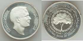 Hussein Ibn Talal Proof 1/4 Dinar AH 1394 (1974), KM29. 33mm. 19.51gm. Mintage: 550. For the 10th anniversary of the Central Bank of Jordan.

HID09801...