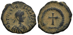 Theodosius II. (402-450 AD). AE. Nummus. Antioch. (1.1 Gr. 13mm.)
Diademed bust of Theodosius II. right.
 Rev. Cross in wreath. artificial sandpatina.
