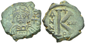 Justinian I (527-565) AE Half Follis (25mm, 11.1 g) Theoupolis Antioch, RY 32 (558/9). Obv: Helmeted and cuirassed bust facing, holding globus crucige...