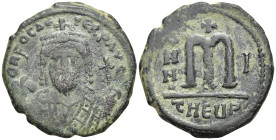 Phocas. AD 602-610. AE follis, (27mm, 10.4 g) Antioch as Theopolis. DN FOCAS PERP AVG, crowned and mantled bust facing, holding mappa and cross on glo...
