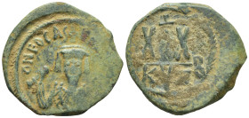 Phocas (602-610 AD). Kyzikos AE Half Follis (5.5 Gr. 21mm.) 
Crowned bust facing, wearing consular ropes, holding mappa and cross. 
Rev. Large XX, sta...