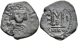 Heraclius (610-641 AD). Nicomedia. AE Follis (28mm 11.1 g) Obv: Helmeted and cuirassed bust facing, holding globus cruciger and shield decorated with ...