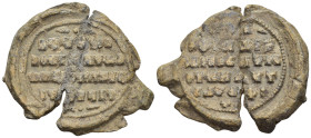 BYZANTINE LEAD SEAL. (8.9 Gr. 22mm.) 
Legend in 4 lines. 
Rev. Legend in 5 lines.