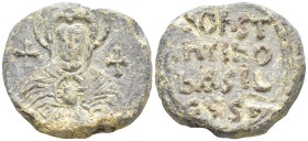 Byzantine Lead Seal (17.4 Gr. 23mm.) 
Nimbate bust of the Virgin Mary, facing, between two crosses, holding a medallion of a facing head of Christ on ...