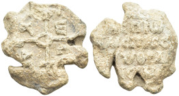 Byzantine Lead Seal (18.9 Gr. 26mm.) 
The form of a cruciform monogram.
 Rev. Legends in four lines.