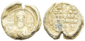 Byzantine Lead Seal (3.5 Gr. 15mm.) 
 Bust of Saint Basi(?)l facing, nimbate, raising his right hand in benediction and holding book of Gospels in his...