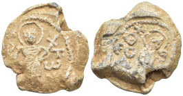 Byzantine Lead Seal, (21mm, 10,0 g) Nimbate saint standing facing holding long cross. / Saint Theodore, nimbate, standing facing,.