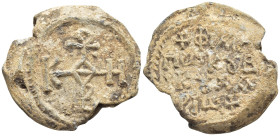Byzantine Lead Seal, (23mm, 14.0 g) Cruciform monogram. / Legends in four lines.