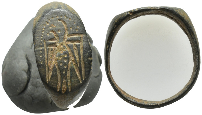 A Bronze ring . (4.8 Gr. 19mm.)