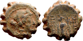 Uncertain ruler (Seleukid kings: III – I BC_ Bronze. Obverse: Bust of Apollo. Rev: Standing Nike