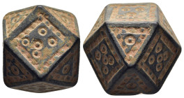 ISLAMIC WEIGHTS (circa 10-13th centuries). Commercial weight of 10 Dirhams or 1 Uqiya. Bronze.

A coin weight in the form of a polyhedron; decorated w...