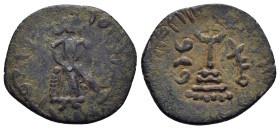 ISLAMIC. Umayyad Caliphate. Time of 'Abd al-Malik ibn Marwan (AH 65-86). Ae Fals. Standing Caliph type. Manbij.

Obv: Caliph standing facing, placing ...