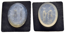 ROMAN PROVINCIAL. An engraved chalcedony seal stone, depicting two togate male figures standing vis-a-vis, holding a corn ear between them (ca. 1st-3r...