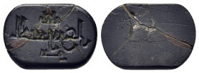 ISLAMIC. An engraved hematite seal stone (ca. 1st - 3rd century AH).

Inscribed 'al Hussain ibn Ali'.

Condition: Some cracks, otherwise very fine.

W...