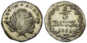Schweiz. Schwyz - Kanton.

 2/3 Batzen (Silber). 1811.
Vs: Wappen zwischen Zweigen.
Rs: Wertbezeichnung und Jahr in Kranz.

23 mm. 2,12 g. 

H...