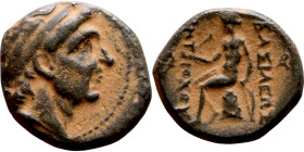 Antiochos III The Great (Seleukid King: 223-187 BC). AE bronze. Obv.: Laureate head of Apollo Rev.: Apollo seated left on omphalos, testing arrow and ...