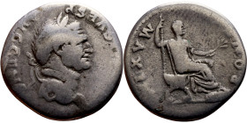 Vespasian (69-79) Denarius. Obv: Bust of emperor. Rev: Vespasian seated on a curule chair, facing right, holding a long scepter and a branch, surround...