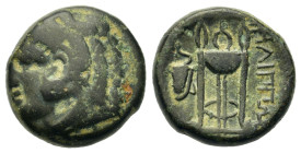 Macedon, Philippi, c. 356-345 BC. Æ (16,3mm, 6.2g). Head of Herakles left, wearing lionskin headdress. R/ ΦIΛIΠΠΩN to right of tripod, bow in bowcase ...