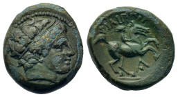 Kings of Macedon. Philip II (359-336 BC). Head of Apollo right, wearing taenia. R/ Naked youth on horse prancing right, dot in Λ below. SNG ANS 935.
