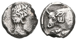 Greek , Ionia, Magnesia ad Maeandrum. AR Obol , c. 4th-3rd century BC.
Laureate head of Apollo right.
Rev. Forepart of bull right;
Klein 408; SNG Tübi...