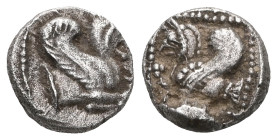 Greek
WESTERN ASIA MINOR, Uncertain. 5th century BC. AR Obol(?) . Forepart of griffin right / Forepart of griffin left in dotted square within incuse...