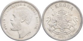 SUÈDE - SWEDEN
Oscar II (1872-1907). 1 krona, 1er type 1875 ST, Stockholm.
Delz.31 - KM.741 ; Argent - 7,47 g - 25 mm - 12 h
Une fine rayure à l’avers...