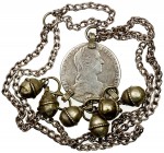 WORLDWIDE: silver necklace, containing a worn Maria Theresa "1780 " thaler and 6 silver balls, 93g, probably early 20th century, likely of East Africa...