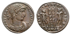 Constantine I (307/310-337). Æ Follis (18mm, 2.15g, 12h). Constantinople, 330-3. Rosette-diademed, draped and cuirassed bust r. R/ Two soldiers flanki...