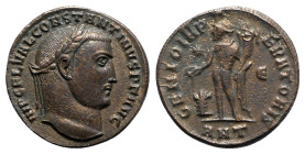 Constantine I (307/310-337). Æ Follis (23mm, 5.54g, 12h). Antioch, AD 310. Laureate head r. R/ Genius standing l., holding patera and cornucopiae; sta...
