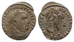 Licinius I (308-324). Æ Follis (22.5mm, 3.27g, 12h). Heraclea, AD 313. Laureate head r. R/ Jupiter standing front, head l., holding Victory on globe a...