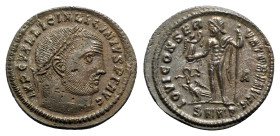 Licinius I (308-324). Æ Follis (23mm, 3.94g, 11h). Heraclea, AD 313. Laureate head r. R/ Jupiter standing front, head l., holding Victory on globe and...