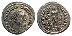 Licinius I (308-324). Æ Follis (20mm, 4.05g, 6h). Alexandria, 316-7. Laureate head r. R/ Jupiter standing facing, head l., holding Victory on globe an...