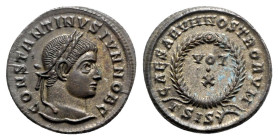 Constantine II (Caesar, 316-337). Æ Follis (19mm, 2.98g, 12h). Siscia, 321-4. Laureate head r. R/ VOT/ X in two lines within laurel wreath; ΓSIS-sunbu...