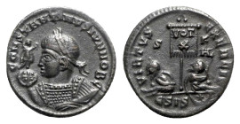 Constantine II (Caesar, 316-337). Æ Follis (19mm, 3.17g, 6h). Siscia, c. AD 320. Laureate and mantled bust l., holding Victory on globe and mappa. R/ ...