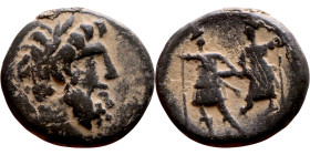 Ptolemaios (Tetrarch of Chalkis: 1 th century BC) bronze coin. Obverse: Laureate head of Zeus right. Reverse: ΠTOΛEMAIOY TETΡAΡXOY KAI AΡXI IEΡ, The D...