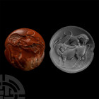 Minoan Red Jasper Seal Depicting a Lion Attacking a Bull