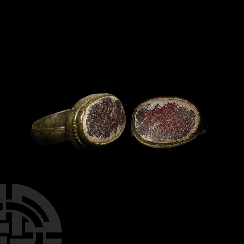Byzantine Bronze Ring with Marbled Red Glass Cabochon

14th-15th century A.D. ...