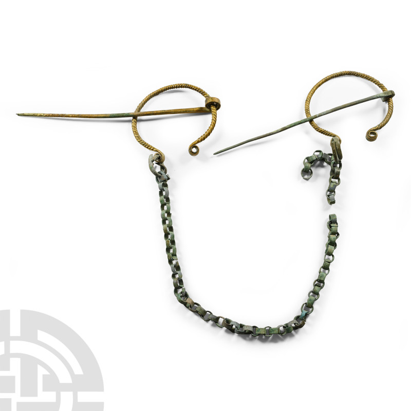 Viking Penannular Brooch and Chain Set

10th-11th century A.D. Comprising: a m...
