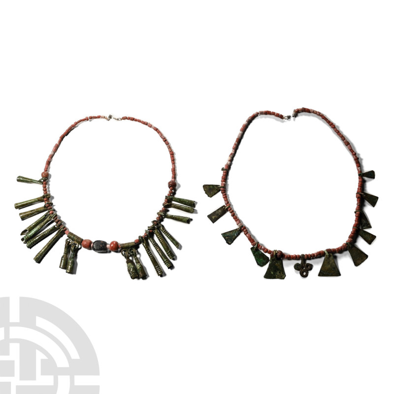 Viking Age Glass Bead Necklaces with Bronze Pendants

9th-12th century A.D. Co...