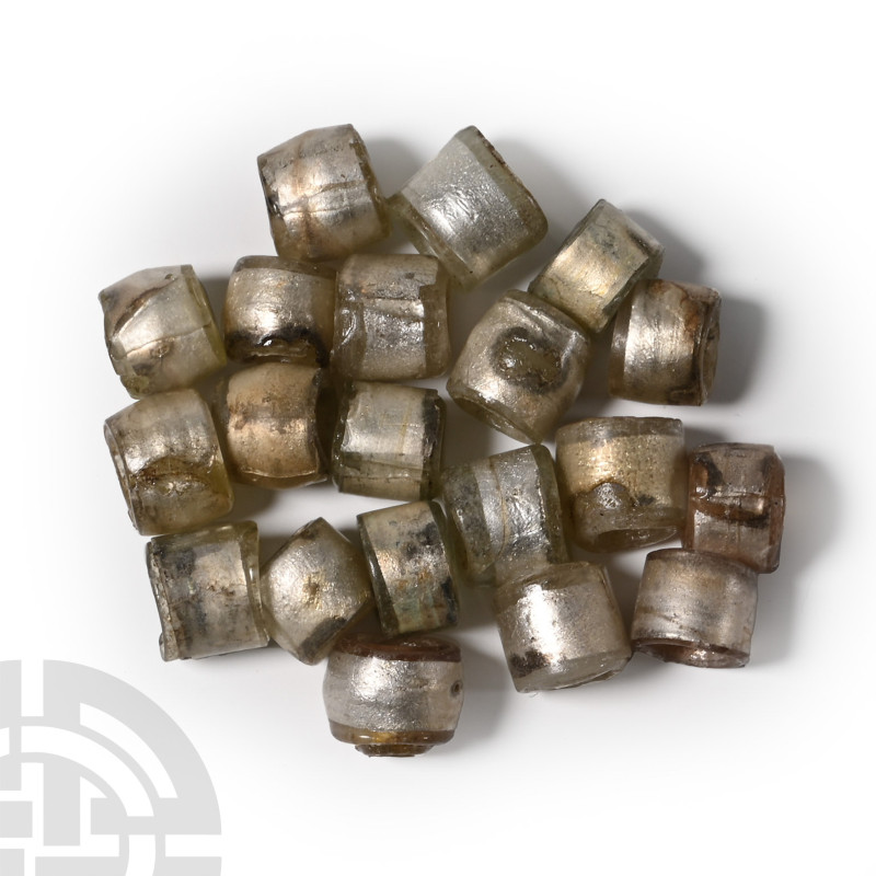 Viking Age Silver in Glass Bead Group

Circa 9th-11th century A.D. Barrel-shap...