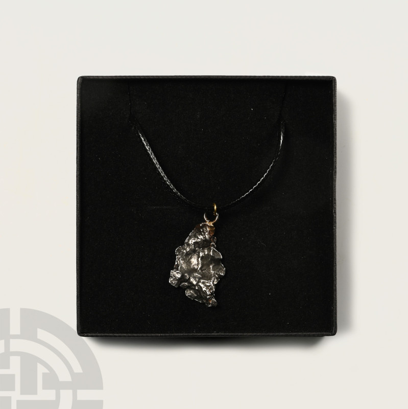 Camp Del Cielo Meteorite Necklace

Fell 6000-5000 years B.P. Comprising a sect...