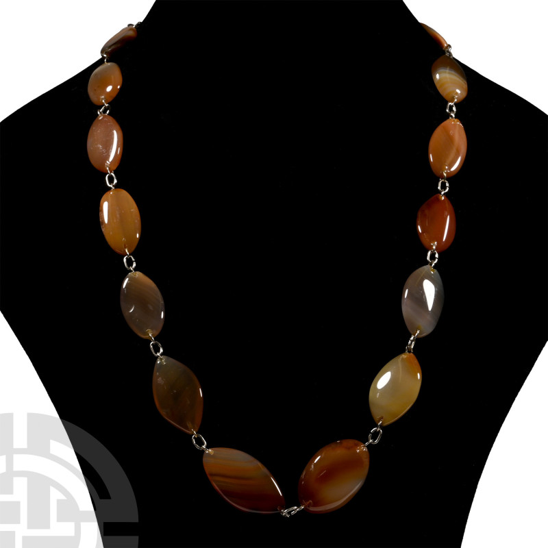 Mixed Polished Agate Bead Necklace

Composed of graduated oval disc beads with...