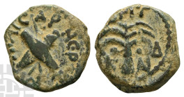 Judaea. Procurators, Antonius Felix AE Prutah. 52-59 CE. Jerusalem mint. In the names of Nero Claudius Caesar and Britannicus Caesar. Dated RY 14 of C...
