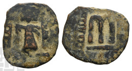 Arab-Byzantine, Umayyad Caliphate AE Fals. Time of 'Abd al-Malik ibn Marwan, AH 65-86 (AD 685-705). Yubna mint. Standing caliph coinage, type 7. Yubna...