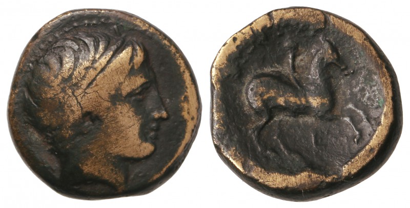 AE 18. 359-336 a.C. FILIPO II. MACEDONIA. Anv.: Cabeza de Apolo a derecha. Rev.:...