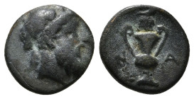 CYCLADES, Naxos. Circa 4th Century BC. Æ . Bearded head of Dionysos left / Kantharos, N-A. 1,48 g