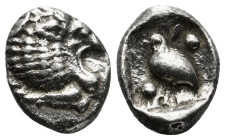 CARIA. Mylasa. Tetartemorion (Circa 420-390 BC).
Obv: Head of roaring lion right.
Rev: Bird standing left; pellet to upper left and lower right; all w...