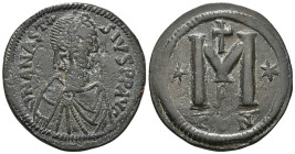 ANASTASIUS I (491-518). Follis. Constantinople.
Obv: D N ANASTASIVS P P AVG.
Diademed, draped and cuirassed bust right.
Rev: Large M; star to left and...